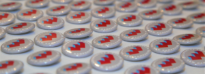 Row of NH Women's Foundation button pins